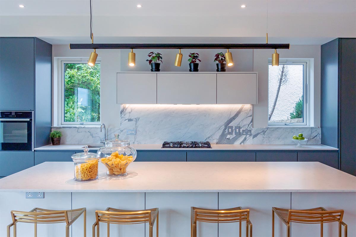 bespoke linear pendant chandelier over modern kitchen