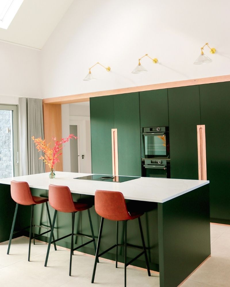 Slopped ceiling kitchen with prismatic glass wall lights